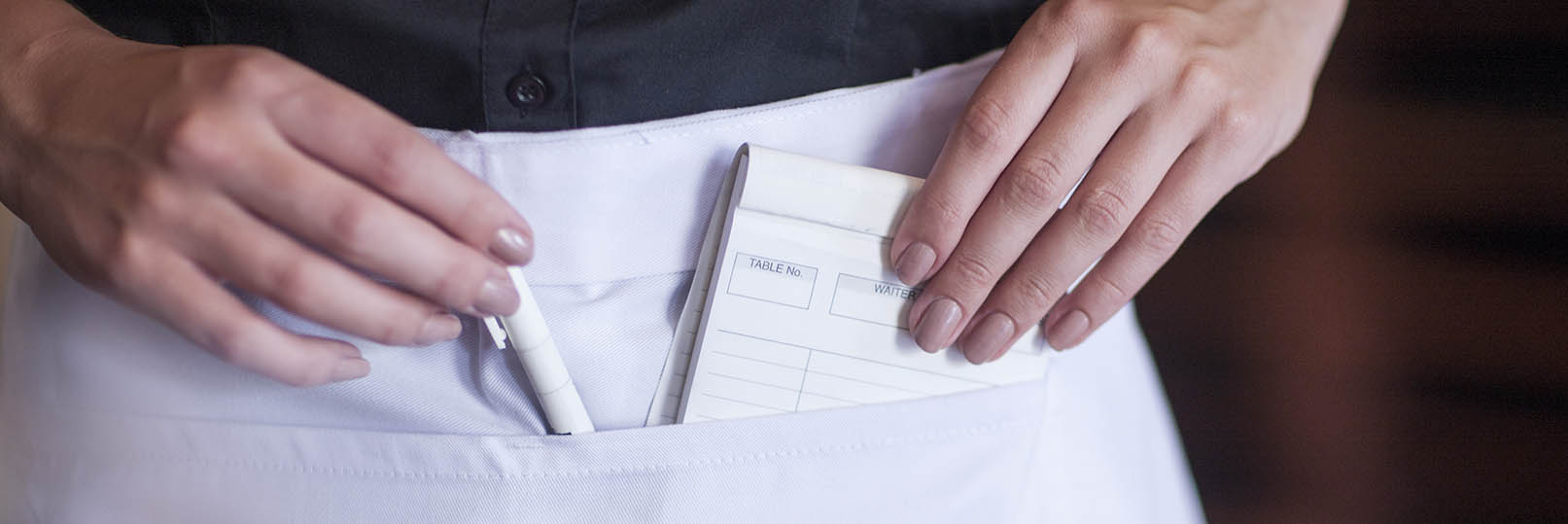 close-up of a waitress's apron with pockets